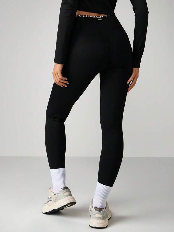 Missguided Missguided X Playboy Cross Over Waistband Sports Leggings With Leopard Print
