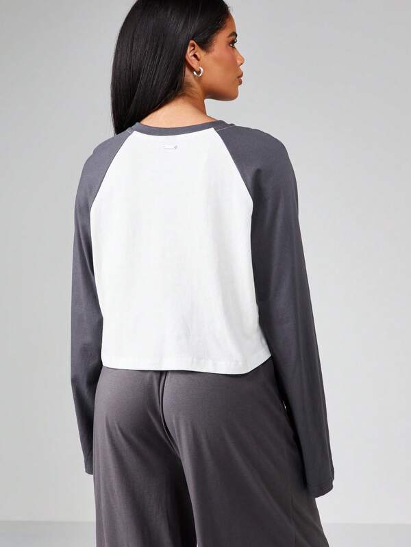 Missguided Missguided X Playboy Embossed Design Raglan Long Sleeve Cropped Top