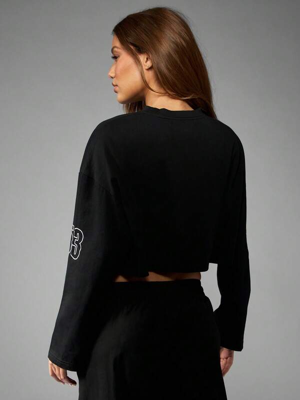 Missguided Missguided X Playboy Long Sleeve Cropped Graphic Tee With Racing Design