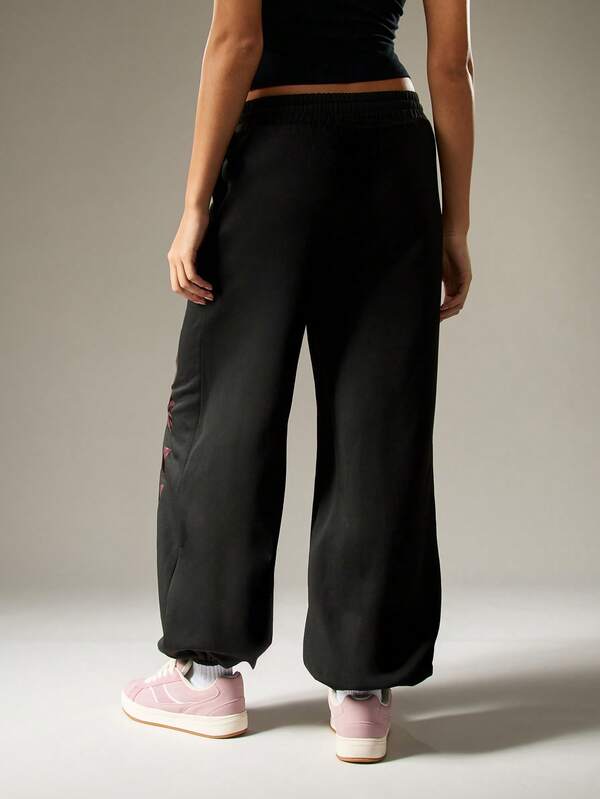 Missguided Missguided X Playboy Oversized Graphic Joggers With Camo Print