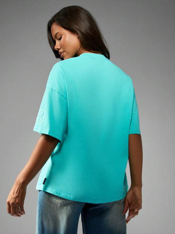 Missguided Missguided X Playboy Oversized Turquoise Tee With Racing Club Print