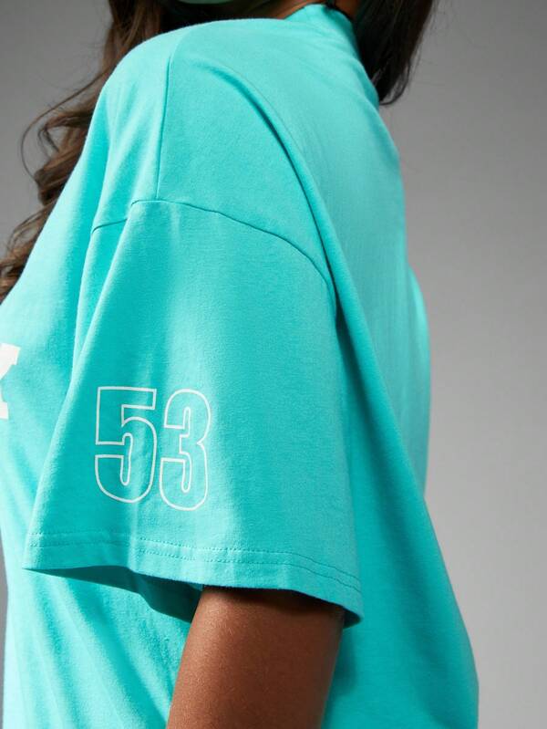 Missguided Missguided X Playboy Oversized Turquoise Tee With Racing Club Print