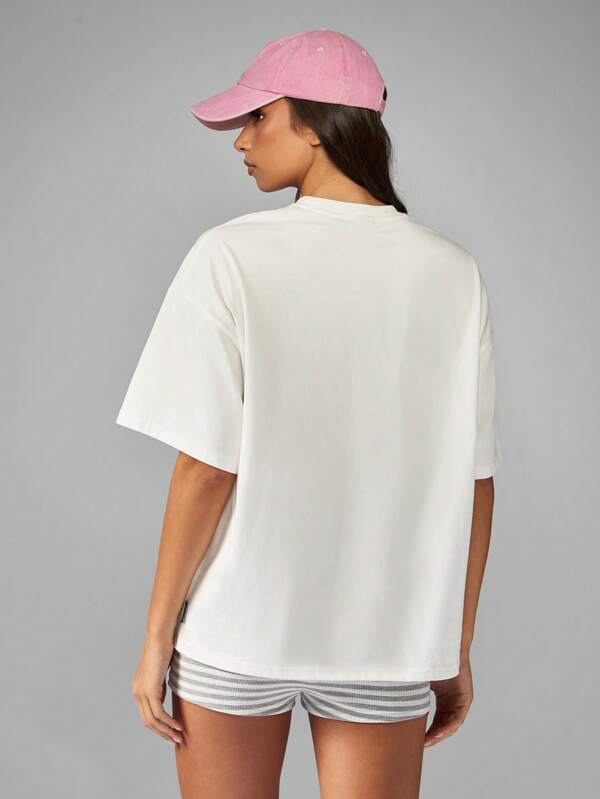 Missguided Missguided X Playboy Oversized White T Shirt With Pink Bunny Graphic Print