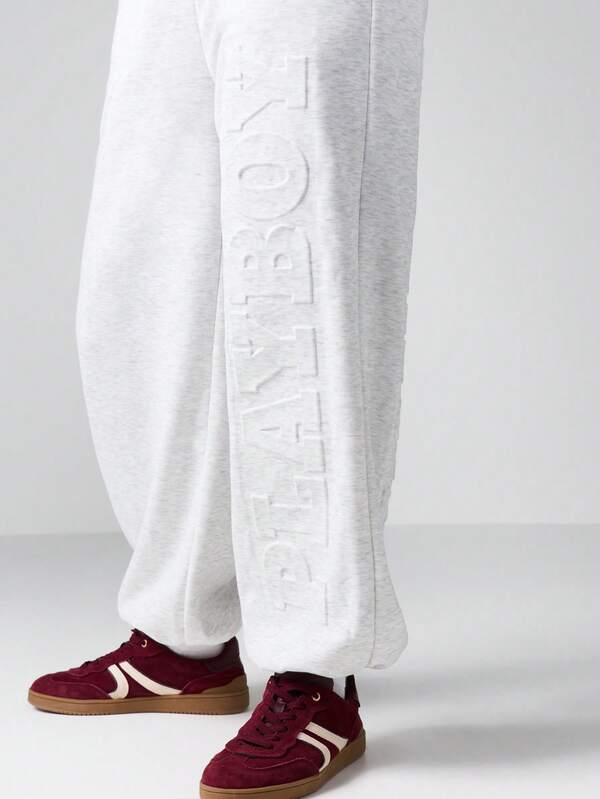 Missguided Missguided X Playboy Wide Leg Cuffed Joggers With Embossed Logo Pattern