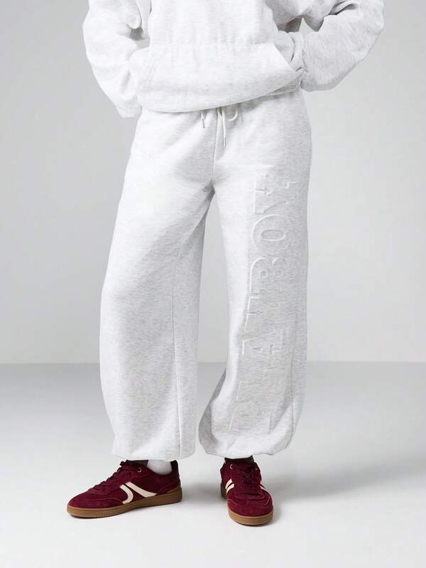 missguided Missguided x Playboy Wide Leg Cuffed Joggers With Embossed Logo Pattern