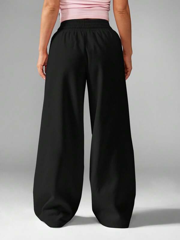 Missguided Missguided X Playboy Wide Leg Palazzo Pants With Drawstring And Logo Print