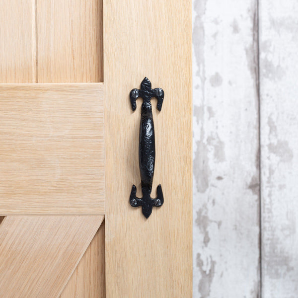 Nicola Spring 150mm Black Rustic Fleur De Lis Door Handle