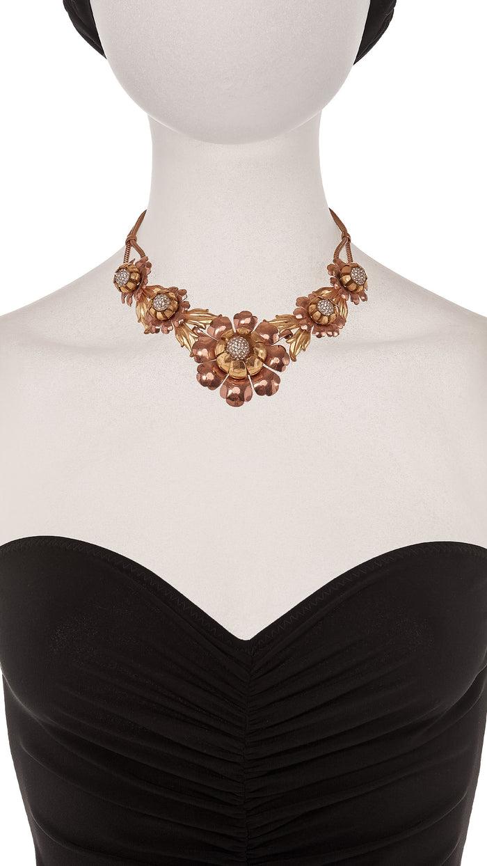 Norma Kamali THREE TONED BRASS FLORAL NECKLACE WITH CRYSTAL CENTER