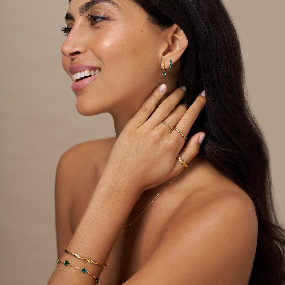 Orelia Emerald Huggie Hoop Earrings Made With Swarovski® Crystals - Gold