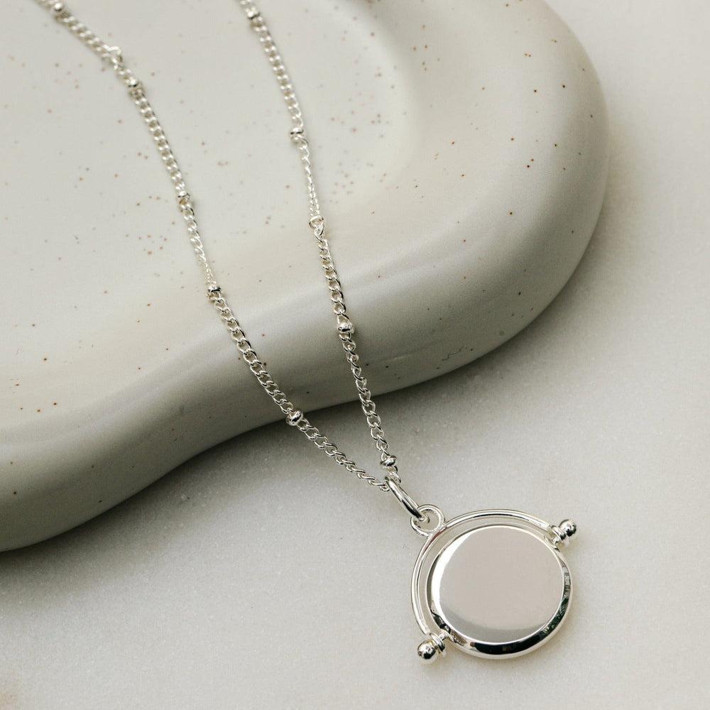 Orelia LUXE Faceted Disc Spinner Necklace - Silver