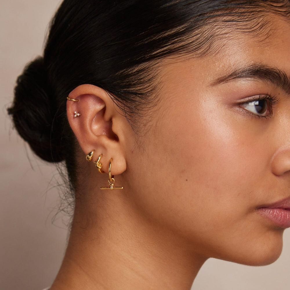 Orelia Polished Knot Huggie Hoop Earrings - Gold