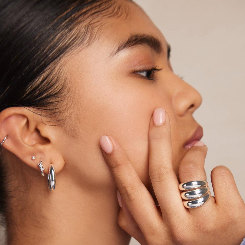 Orelia Polished Knot Huggie Hoop Earrings - Silver