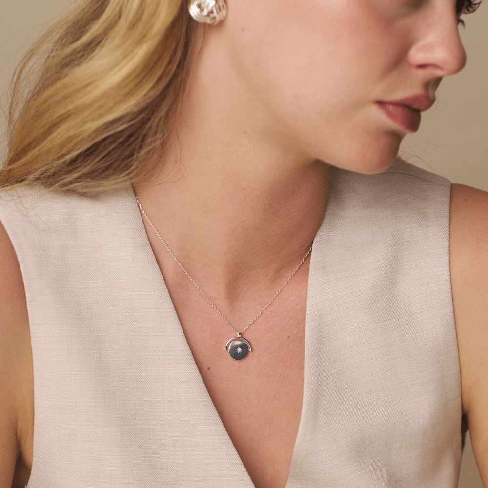 Orelia Starburst Coin Spinner Necklace Silver