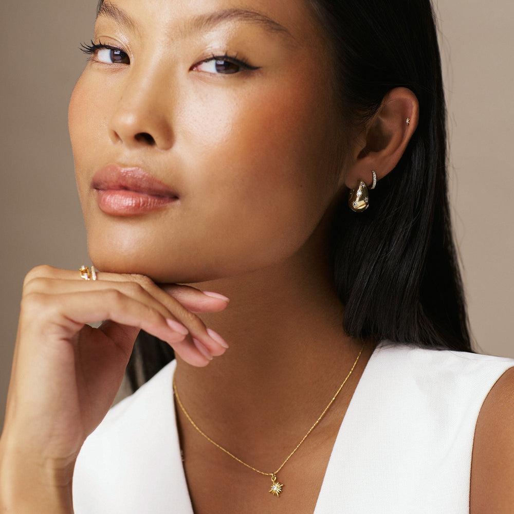 Orelia Tapered Crystal Starburst Hoop Earrings