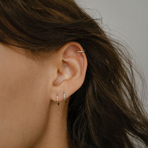 Otiumberg Essential Huggie Hoops 9kt Solid Gold