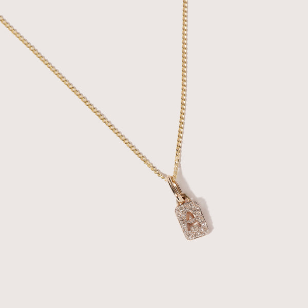 otiumberg Tiny Diamond Initial Tag Pendant 9kt Solid Gold