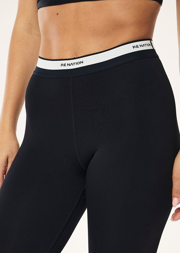 p.e nation Avant full length legging in black & whisper white
