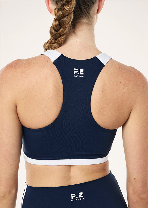 p.e nation Highgate sports bra in dark navy & optic white
