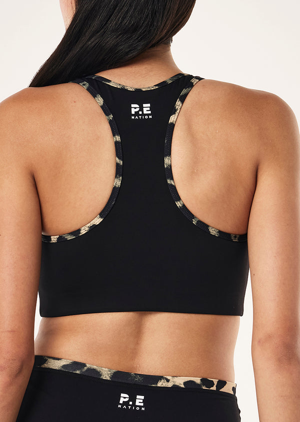 p.e nation Stellar sports bra in black & leopard