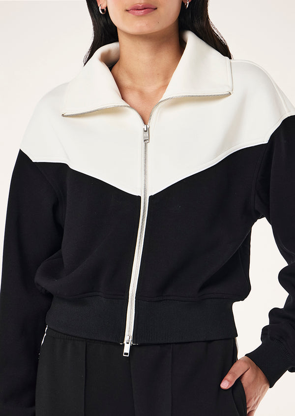 p.e nation Triumph jacket in black & whisper white