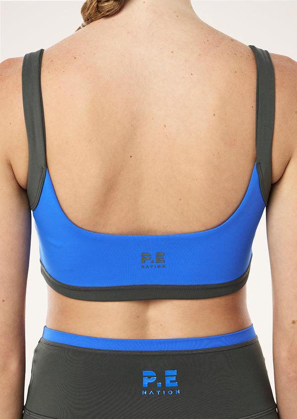 p.e nation Vivid sports bra in royal blue & gunmetal