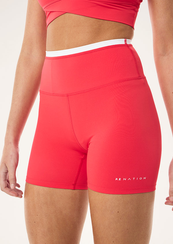 p.e nation Stellar 5" bike short in strawberry & optic white