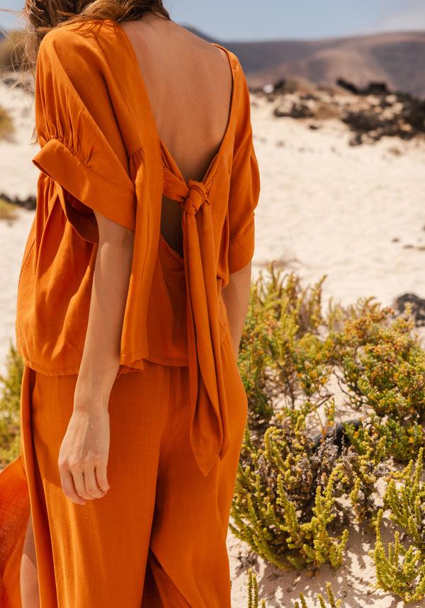 paisie Relaxed Fit Top with Back Bow Detail