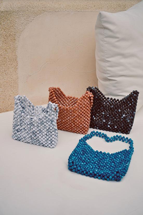 Pink Haley Aurora Beaded Clutch In Marble Mauve