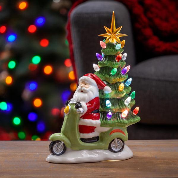 plow & hearth Heartfelt Cheer LED Table Décor Resin Santa on Scooter with Christmas Tree 12.25"H