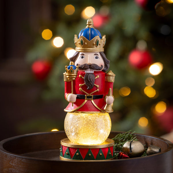 plow & hearth Joyful Traditions LED Table Decor Resin Nutcracker with Crackle Glass Globe 9.25"H
