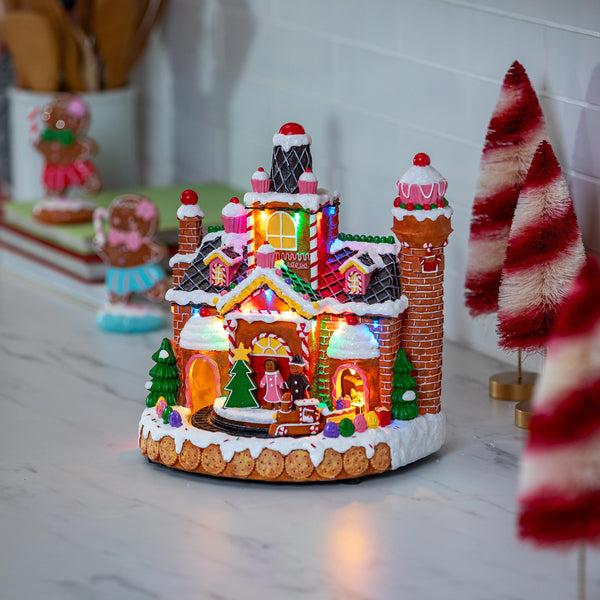 plow & hearth Sugar & Stripes Bright LED Table Decor Resin Gingerbread House and Train Motion and Music 11.25"H