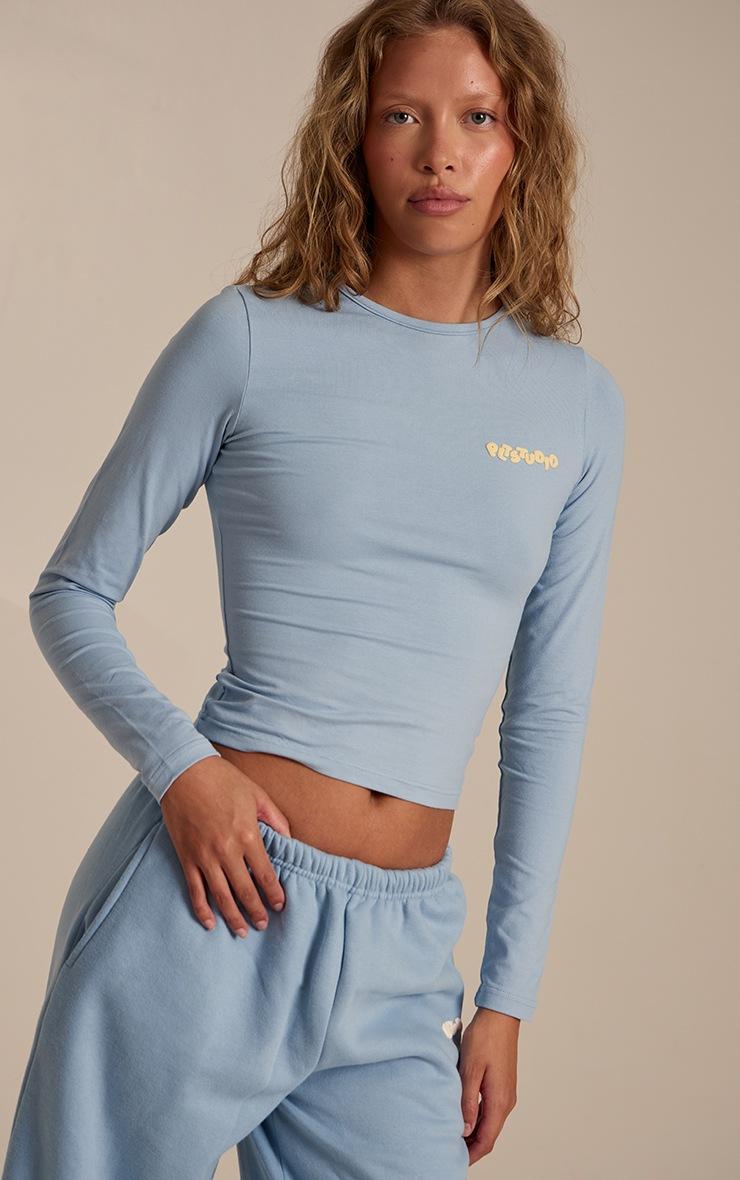 Pretty Little Thing Baby Blue Plt Studio Puff Print Cotton Long Sleeve Crop Top