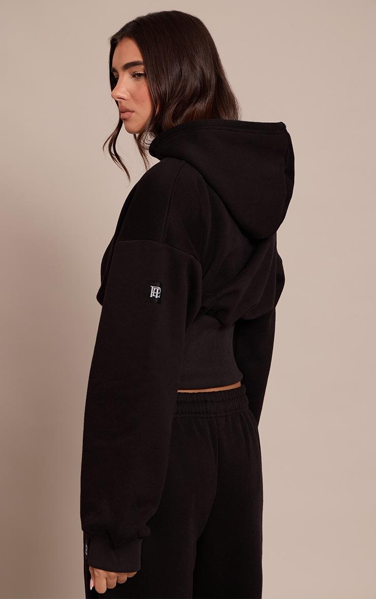 Pretty Little Thing Black PLT Tab Cinched Waist Crop Hoodie