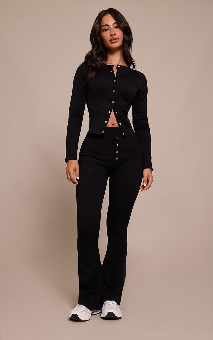 Pretty Little Thing Petite Black Snatched Rib Button Detail Flare Leggings Pretty Little Thing Petite Black Snatched Rib Button Detail Flare Leggings