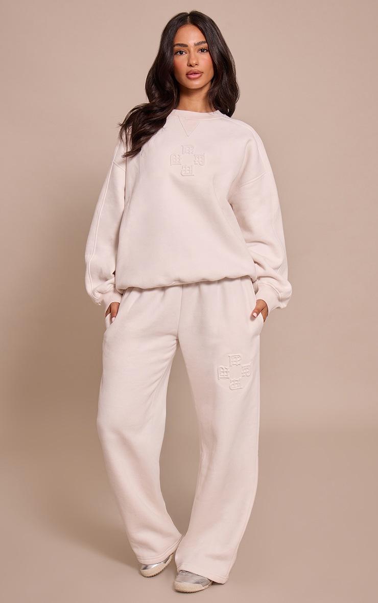 Pretty Little Thing Petite Cream PLT Embossed Wide Leg Sweatpants