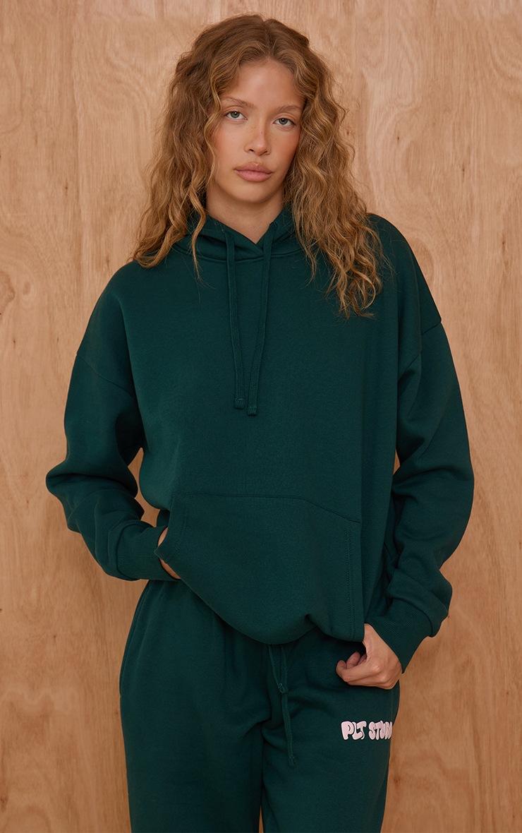 Pretty Little Thing Pine Green PLT Studio Print Oversized Hoodie