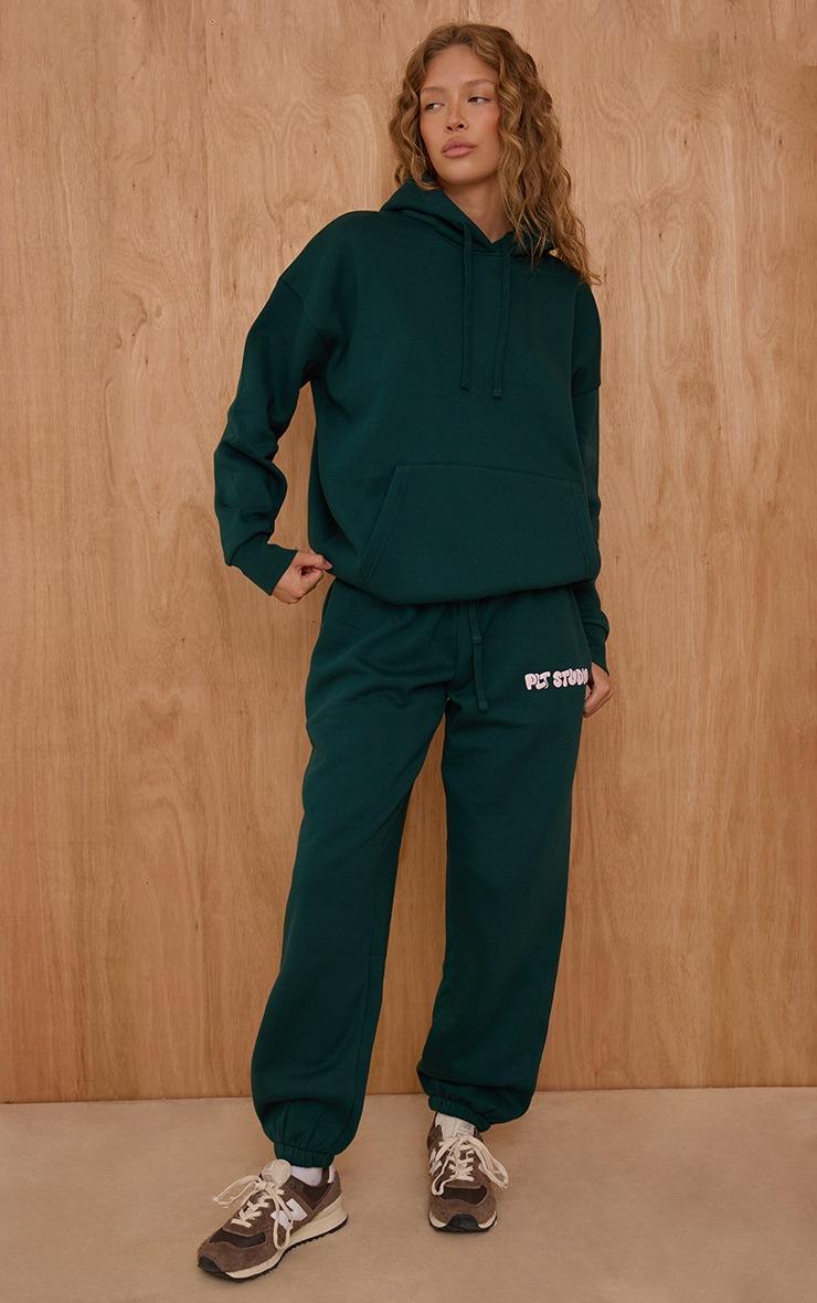 Pretty Little Thing Pine Green PLT Studio Print Oversized Hoodie
