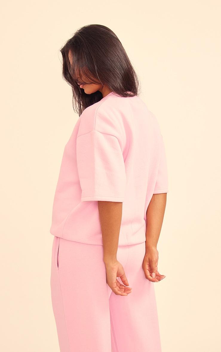 Pretty Little Thing PRETTYLITTLETHING Baby Pink Badge Detail Oversized Short Sleeve Sweatshirt