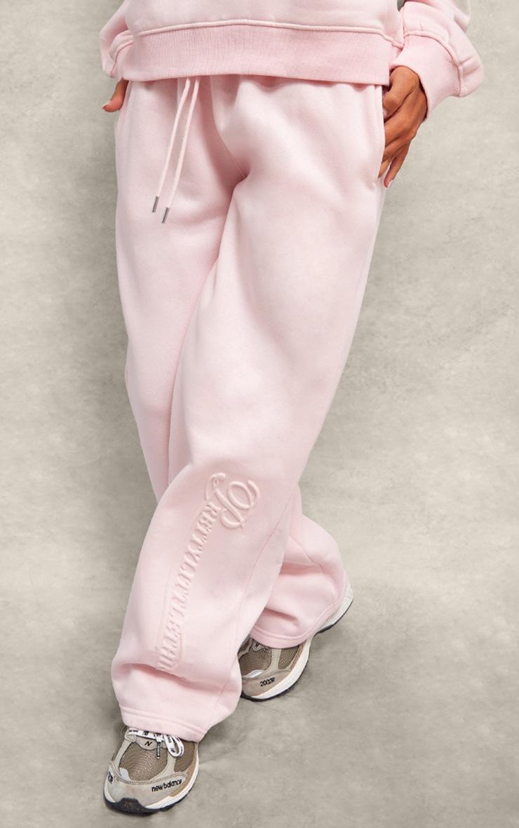 Pretty Little Thing PRETTYLITTLETHING Baby Pink Embossed Graphic Straight Leg Sweatpant