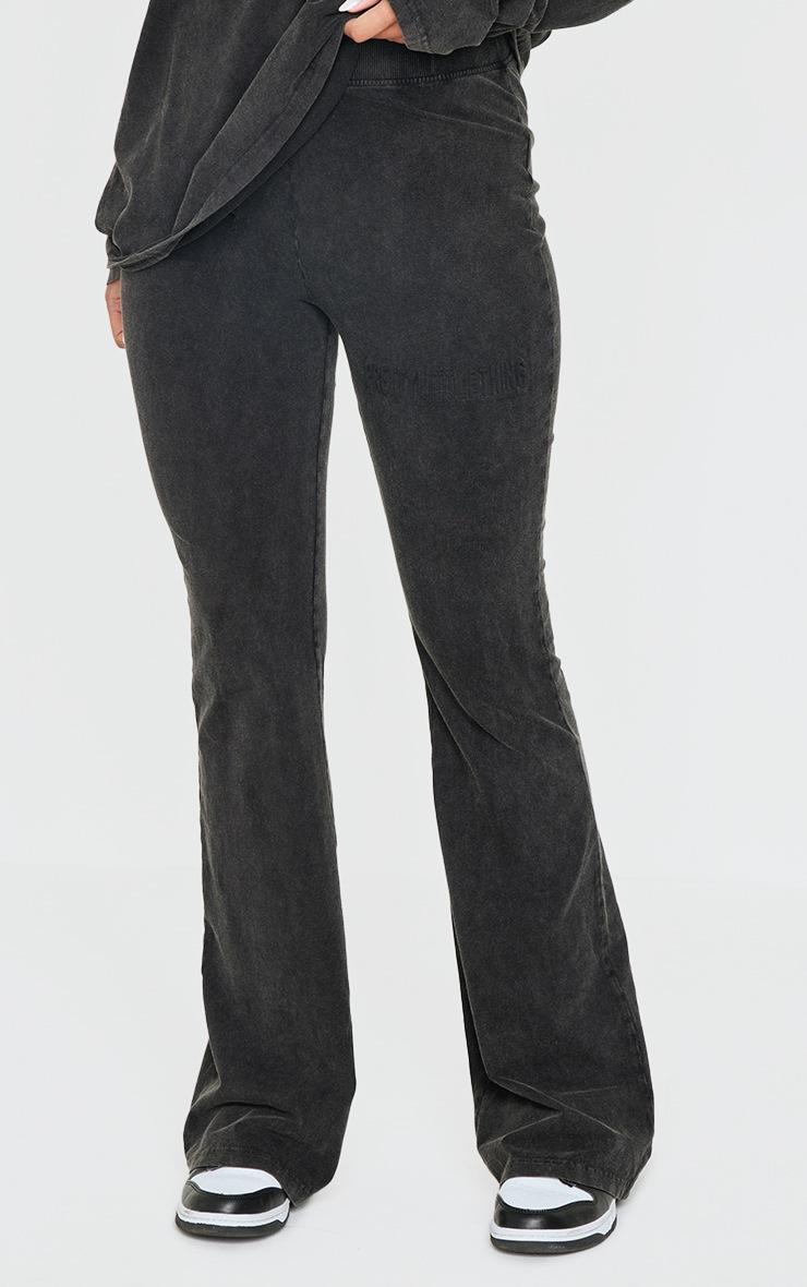 Pretty Little Thing PRETTYLITTLETHING Black Embossed Logo Washed Skinny Flare Pants