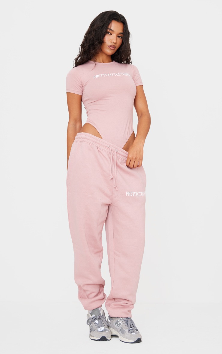 Pretty Little Thing PRETTYLITTLETHING Light Pink Logo Short Sleeve Bodysuit