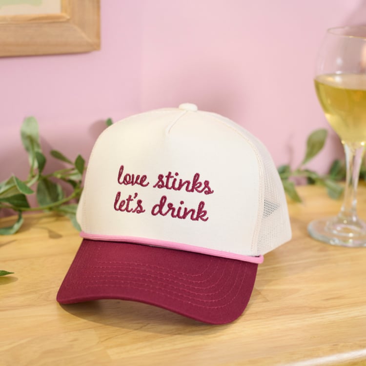 Primitives By Kathy Love Stinks Let's Drink Trucker Hat