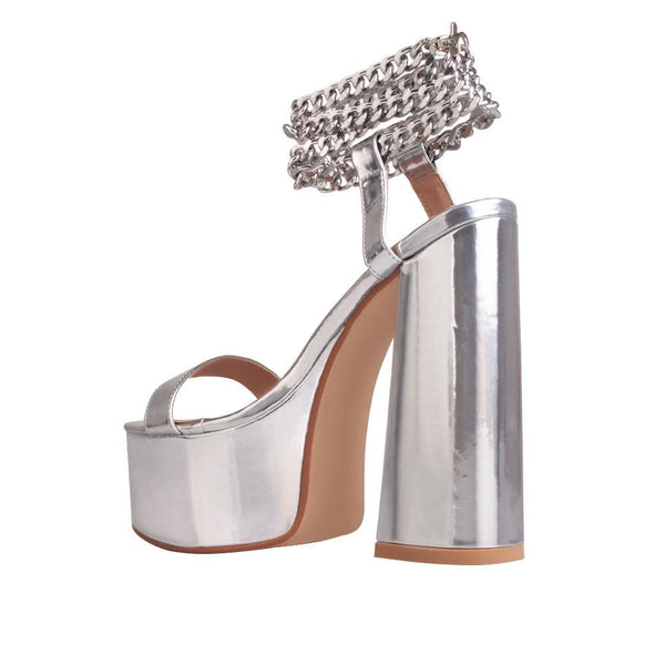 Privileged By J.c. Dossier Valleyheart Silver Platform Heels