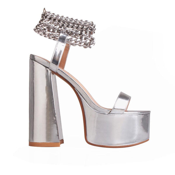privileged by j.c. dossier Valleyheart Silver Platform Heels