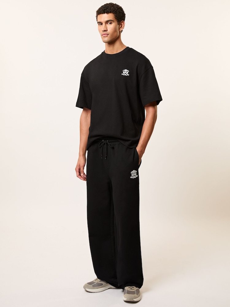 reiss Monogram Cotton Wide-Leg Joggers in Black