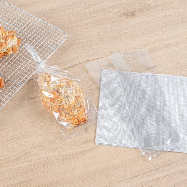 Restaurantware Bag Tek Clear Plastic Gusset Bag - High Clarity Heat Sealable - 3 1/2" X 2 1/4" X 9 3/4" - 100 Count Box