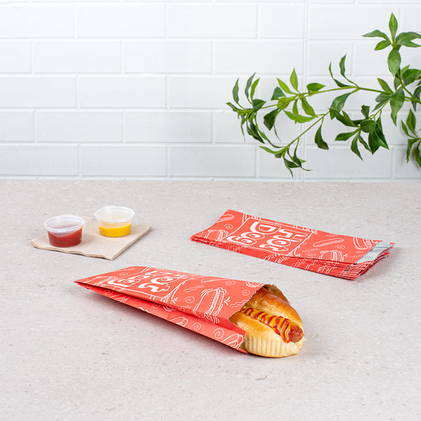 Restaurantware Bag Tek Red Paper Printed Small Hot Dog Foil Bag - 3 3/4" X 1 1/4" X 9" - 100 Count Box