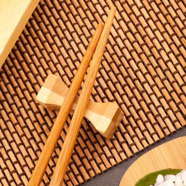 Restaurantware Bambuddha Natural Bamboo Chopstick Rest - Hourglass Duo Color - 1 3/4" X 1/2" X 1/2" - 25 Count Box