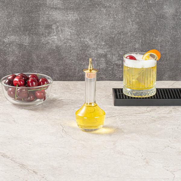 Restaurantware Bar Lux 4 Oz Glass Modern Style Bitters Bottle - Gold-Plated Dasher - 5 3/4" X 2 3/4" X 2 3/4" - 1 Count Box