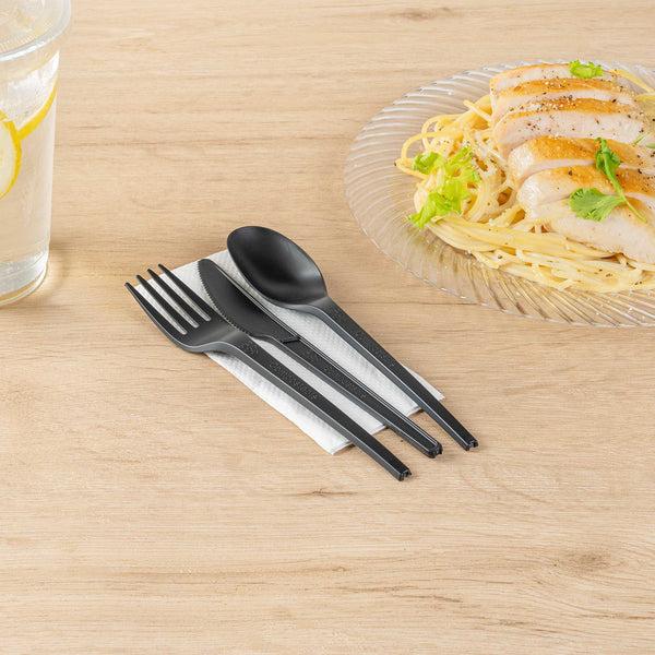 Restaurantware Basic Nature Black CPLA Plastic Cutlery Set - White Napkin Heat-Resistant Compostable - 8 3/4" X 2 3/4" X 3/4" - 100 Count Box
